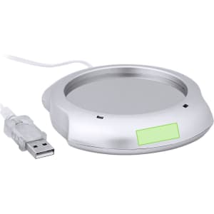 A silver mug warmer with a USB connection, designed to keep beverages warm.
