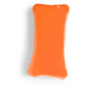 An orange decorative pillow with a soft, plush texture and an organic shape, featuring branding.