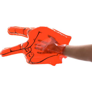 An oversized inflatable hand in bright orange, shaped in a peace sign, held by a hand.