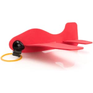 A red novelty airplane toy with wings and a black cockpit area, featuring a launch ring.