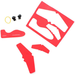 A red novelty aircraft kit with various plastic components and accessories, including rubber bands and connectors.