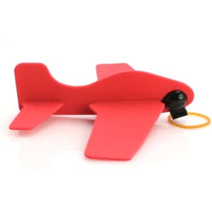 A red toy airplane made of flexible material, featuring a black nose and a yellow rubber band attachment.