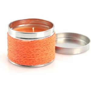 An orange aromatic candle in a metal container with a removable lid, featuring a rope-like texture around it.