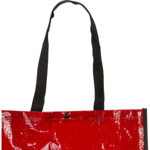 A red reusable grocery bag with black handles and a button closure. The bag has a glossy finish and includes a logo.