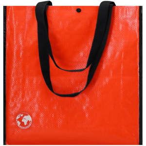 An orange reusable grocery bag with black handles and a logo on the side.