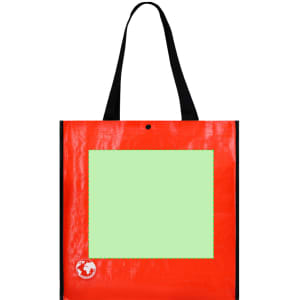 A red reusable grocery bag with black handles and a green panel. It features a logo in the bottom corner.