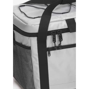 A grey cooler with a black mesh side pocket and sturdy handle, featuring zippers and straps for easy transport.