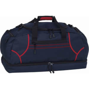 A navy blue duffle bag with red accents and a logo, featuring dual handles and zippered compartments.