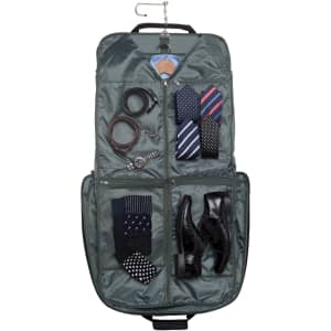A green garment bag with compartments for ties, socks, a watch, shoes, and a hanger. It features a logo.