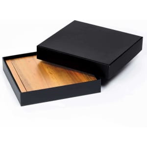 A black clamshell cheese board with a wooden interior, presented in an elegant black packaging.
