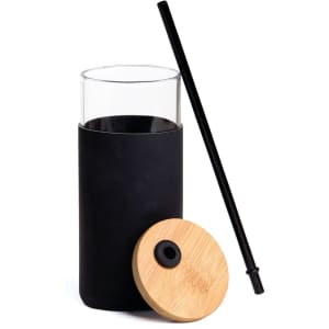 A drink bottle featuring a clear glass body, black silicone sleeve, bamboo lid, and a black straw.
