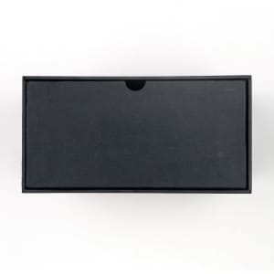 A black box with a minimalist design, suitable for packaging a wine glass set.