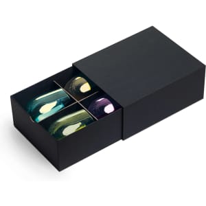 A black gift box containing a set of four colourful wine glasses in blue, green, yellow, and purple.