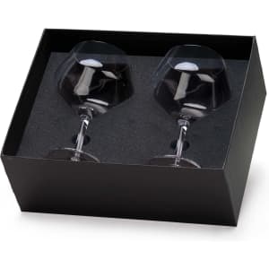 A glass set in a black box containing two stemmed glasses, showcasing a clear design with a sleek finish.