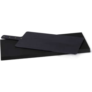 A black Napoli serving board with a handle, displayed on a flat base. The board features a simple design and circular branding.