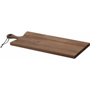 A wooden serving board with a natural finish and a handle, featuring a leather tie.