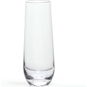 A clear stemless champagne flute with a sleek, modern design and a rounded base.