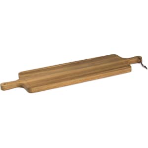 A wooden tapas serving board in a light brown tone with handles on either end.