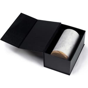 A marble drink cooler in a black gift box, featuring a wooden base. The cooler has a sleek, polished appearance.