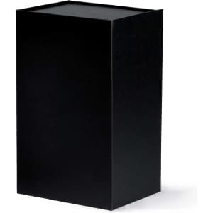 A black box with a simple design, featuring a lid on top and a smooth surface. It has a logo on one side.