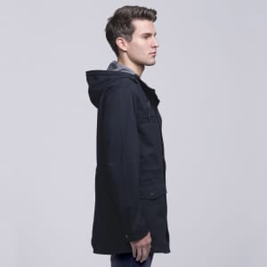 A navy twill jacket featuring a hood, side pockets, and a casual style, with branding visible.