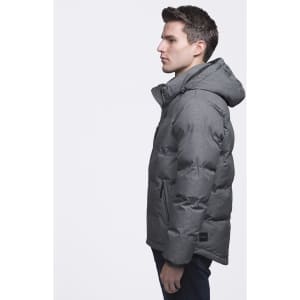 A puffer jacket in grey with a hood, featuring a logo and a side view of a model wearing it.