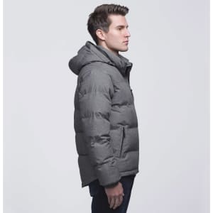 A grey puffer jacket with a hood, featuring a zip closure and side pockets, worn by a man in profile.