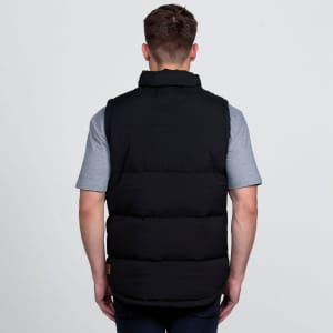 A black puffa vest with a high collar, viewed from the back, worn over a grey t-shirt. Features a logo.