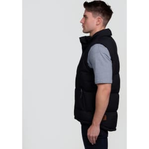 A black puffa vest is displayed on a model from the side, featuring a zip pocket and a logo.
