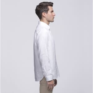 A side profile of a man wearing a white linen button-up shirt. The shirt has a collar and features a logo.