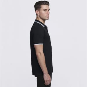 A black polo shirt for men featuring a classic design with white accents, displayed from the side. It includes a logo.