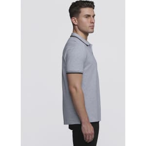 A grey polo shirt with contrasting stripes on the collar and sleeves, featuring a logo.