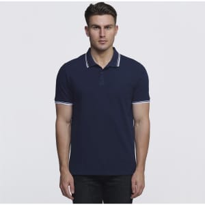 A navy polo shirt with contrasting white trim and a logo, featured in a front view on a model.