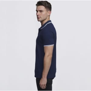 A navy blue men's polo shirt featuring contrasting white trim on the collar and sleeves, with a branding logo.
