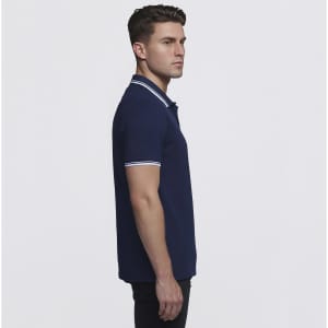 A navy blue polo shirt with contrasting white stripes on the collar and sleeves, featuring a logo.