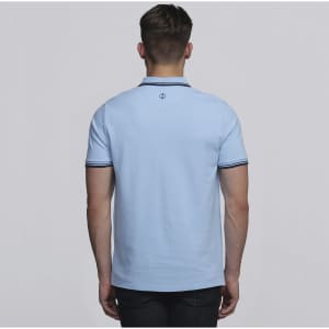 A light blue men's polo shirt featuring contrasting collar details and a logo on the back.