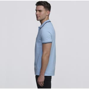 A light blue polo shirt with a contrasting collar and a branding logo. The shirt is worn by a model in profile.