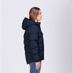 A navy puffer jacket with a hood, featuring a zip and pockets, displayed on a model from the side.