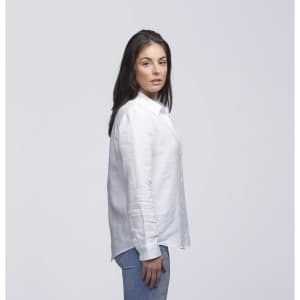 A white linen button-up shirt displayed on a model, featuring a relaxed fit and long sleeves.