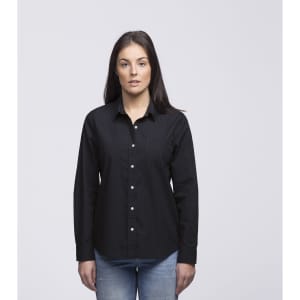 A woman is wearing a black button-up shirt with long sleeves and a collar. The shirt features a logo.