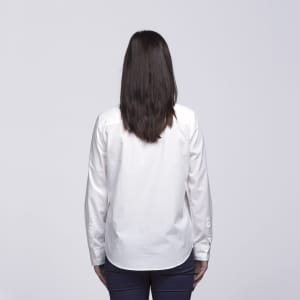 A white button-up shirt viewed from the back, featuring long sleeves and a simple design.