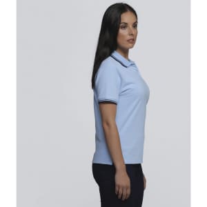 A light blue women's polo shirt with contrasting stripes on the collar, featuring a logo.