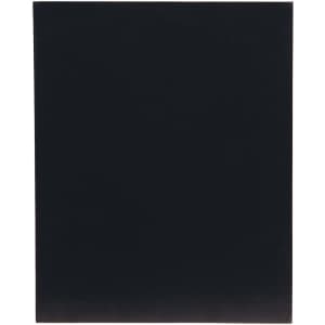 A black board with a smooth surface, featuring a subtle texture, suitable for serving or displaying food.