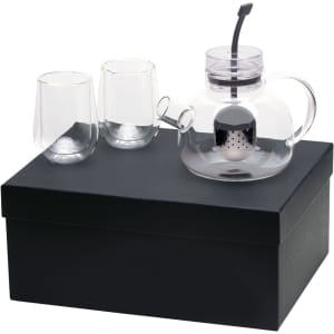 A glass teapot with infuser, accompanied by two glass cups, presented in a black gift box.