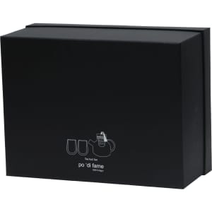 A black box contains a tea set, including a teapot and two cups, with a logo on the front.