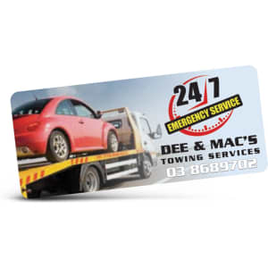 A promotional sticker featuring a tow truck with a car, predominantly in blue and yellow colours, including a logo.