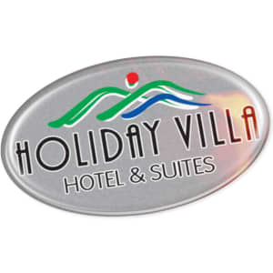 An oval resin-coated label featuring a colourful logo and the text "Holiday Villa Hotel & Suites."