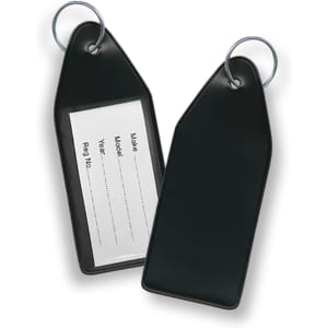 A pair of black vinyl key tags with a metal ring for attachment, featuring a blank label for information.