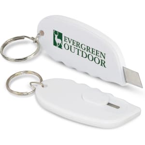 A white mini cutter key ring with a metal blade and a keyring attachment, featuring a logo.