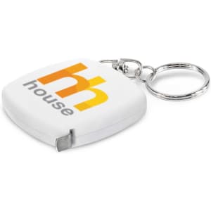 A white tape measure key ring with a silver keychain and a logo on the front.
